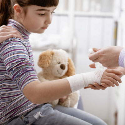 a young girl with a bandage on her wrist
